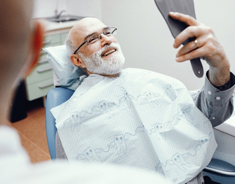 Man smiling after root canal therapy in Gainesville